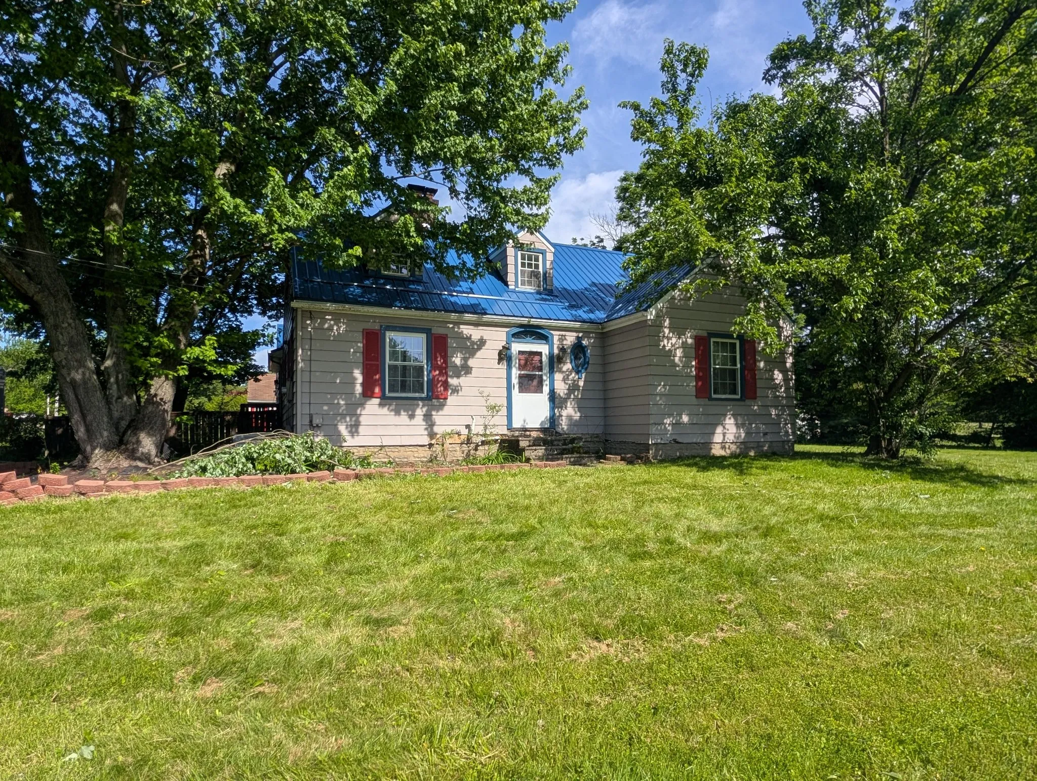 Front elevation, blue metal roof